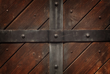 The metal strip on the wooden background
