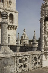 Fototapeta premium Architectural close up of Belem tower in Lisbon from its terrace, with few people around