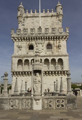 Fototapeta na wymiar Architectural close up of Belem tower frontal facade in Lisbon from its terrace, with few people around