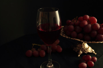 Glass of red wine and fresh grapes