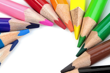 Fototapeta premium Color pencils on white background - macro image 