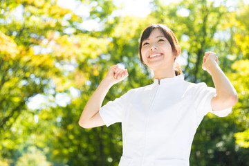 young asian nurse in the park