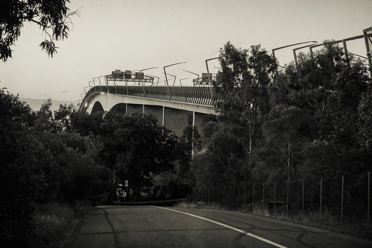 Fototapeta The Gateway Bridge (Sir Leo Hielscher Bridges) at sunset in Brisbane, Queensland, Australia. Abstract black and white image.