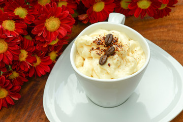 Espresso con panna coffee and Red chrysanthemum flower