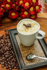 Espresso con panna coffee and Red chrysanthemum flower