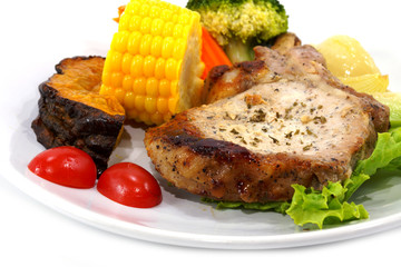 Pork steak and vegetables.