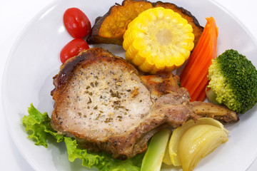 Pork steak and vegetables.