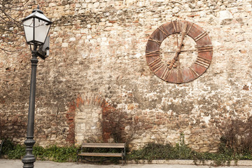 old clock on the wall surrounding cathedral in Zagreb. Croatia.