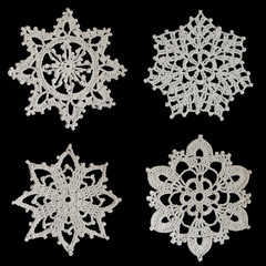 Crocheted snowflakes on a black background
 