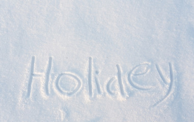 The word Holiday draw on snow 