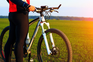 young adult cyclist riding mountain bike in the countryside