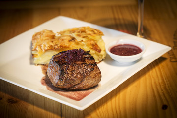 grilled steak with potato onion and cheese bake