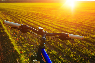 Fototapeta na wymiar Mountain bicycle at sunny evening