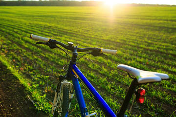 Fototapeta na wymiar Mountain bicycle at sunny evening