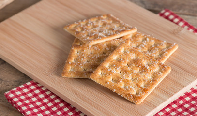 Sugar cracker on wood board.