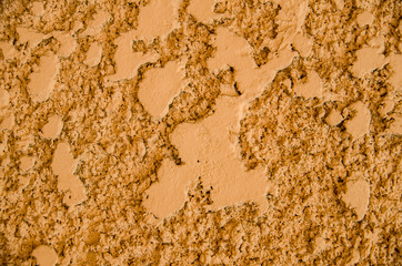 Decorative golden plaster of a wall