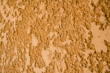 Decorative golden plaster of a wall