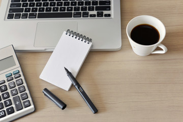 Blank Note Pad, Calculator, Computer, Pen on the Table