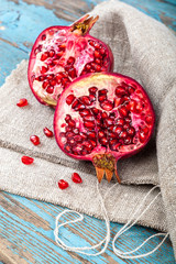 Fresh pomegranate on wooden boards.