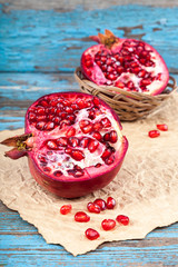 Fresh pomegranate on wooden boards.
