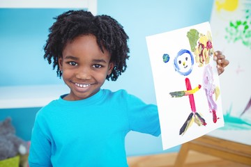 Happy african american kid enjoying arts and crafts painting