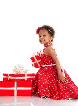 Merry girl with curly hair and red gift boxes. Shopping, presents, holiday, congratulations