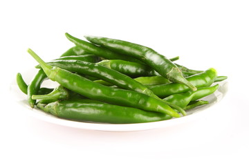 Plate of organic green chilies,