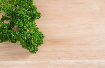 Parsley on wood background. Top view.