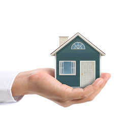 holding house representing home ownership