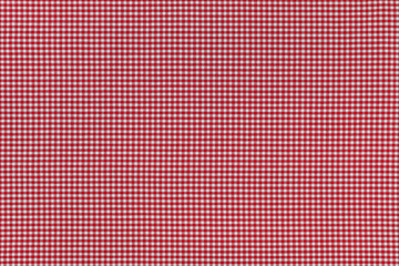 Closeup texture background photo of fabric with checked red Gingham pattern  