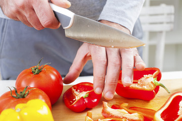 Preparing fresh organic food. Cutting vegetables