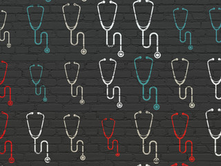 Medicine concept: Stethoscope icons on wall background