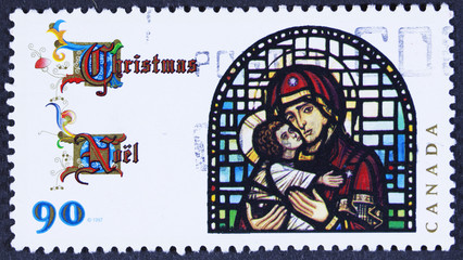 CANADA - CIRCA 1997 A stamp printed in Canada, shows Madonna and Child, by Christopher Wallis glass window in the church of St. Stephen, Calgary, circa 1997 