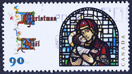 CANADA - CIRCA 1997 A stamp printed in Canada, shows Madonna and Child, by Christopher Wallis glass...