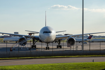 Fototapeta na wymiar Nose of Airplane at Fence