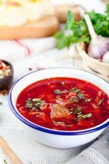 Traditional Ukrainian Russian vegetable soup, borsch with garlic donuts, pampushki.