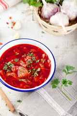 Traditional Ukrainian Russian vegetable soup, borsch with garlic donuts, pampushki.