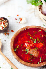 Traditional Ukrainian Russian vegetable soup, borsch with garlic donuts, pampushki .