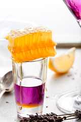Martini, lavender, honey, lemon cocktail on a white background. Vermouth.