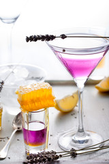 Martini, lavender, honey, lemon cocktail on a white background. Vermouth.