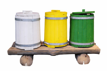 Obraz premium Three colored wooden barrels