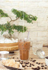 Traditional Vietnamese, Thai Ice coffee with beans on wooden background