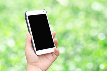 Hand holding mobile smart phone isolated