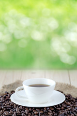 Coffee cup and coffee beans