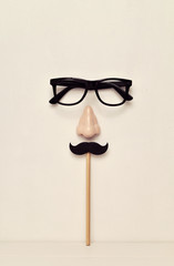 eyeglasses, nose and mustache depicting a man face