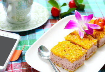 Delicious Gold Egg Yolk Thread Cakes on white plate and coffee.