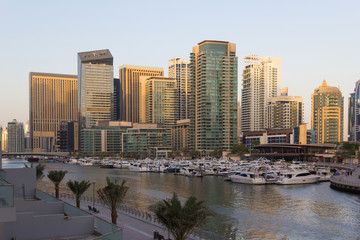 Fototapeta na wymiar Dubai hi-tech cityscape, with modern buildings and fancy stores.