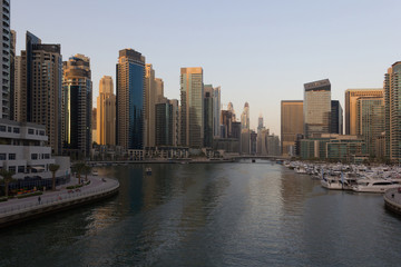 Fototapeta na wymiar Dubai hi-tech cityscape, with modern buildings and fancy stores.