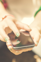 Texting on a smartphone. Shallow depth of field.