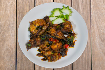 phad pla duk krob (stir fried deep fried catfish with curry past